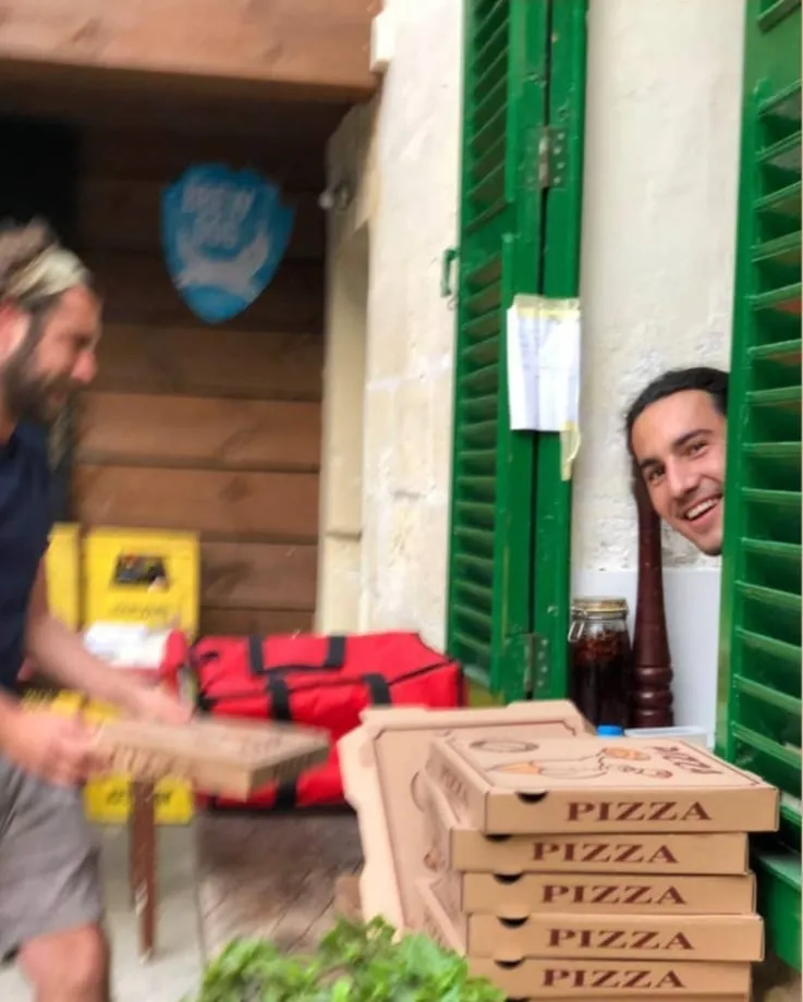 Chef Gianni working in the kitchen at Salumeria Gardens